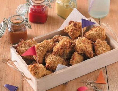 Χρυσές κοτομπουκιές με κορνφλέικς στο φούρνο